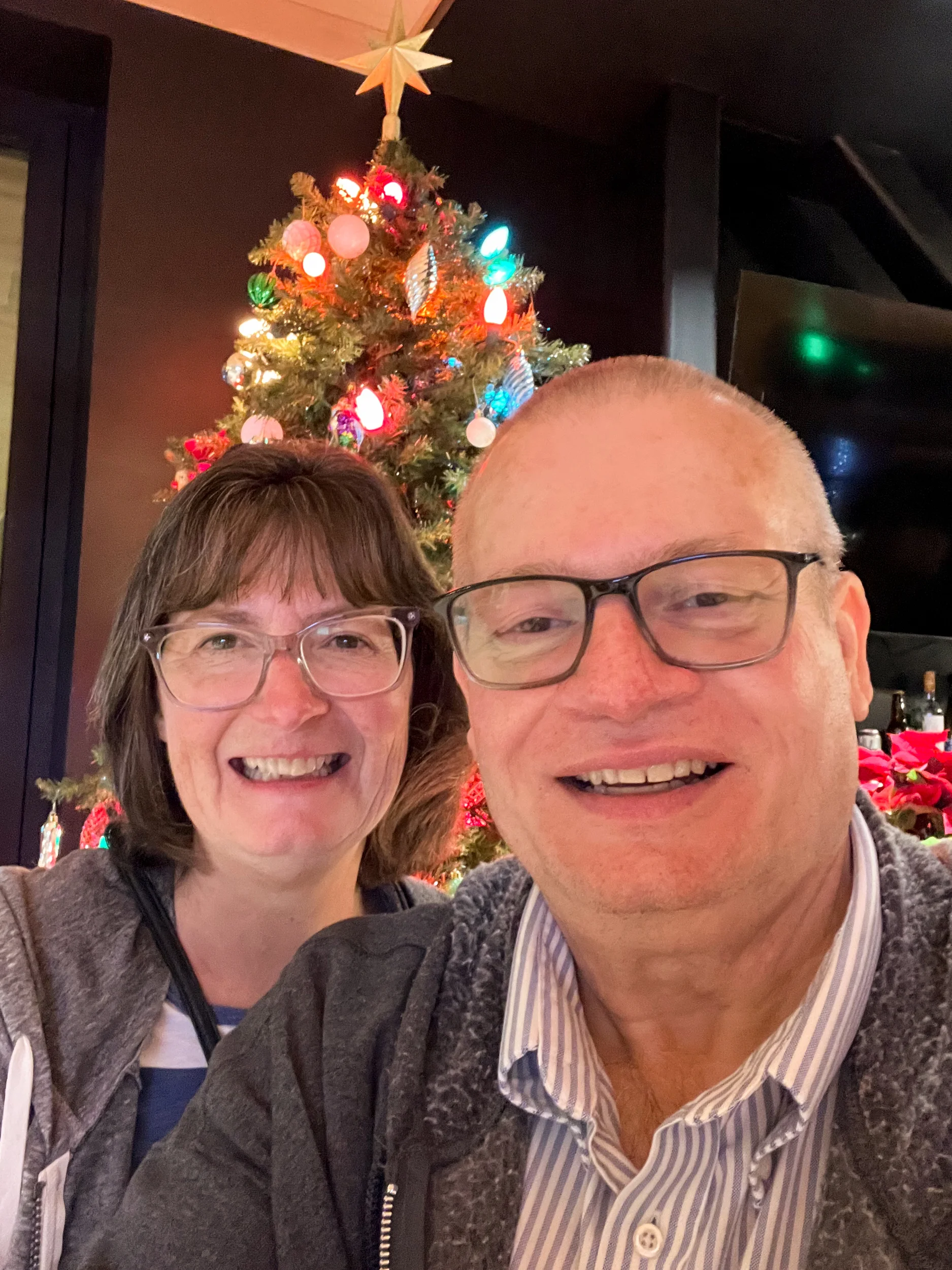 Parents in front of tree