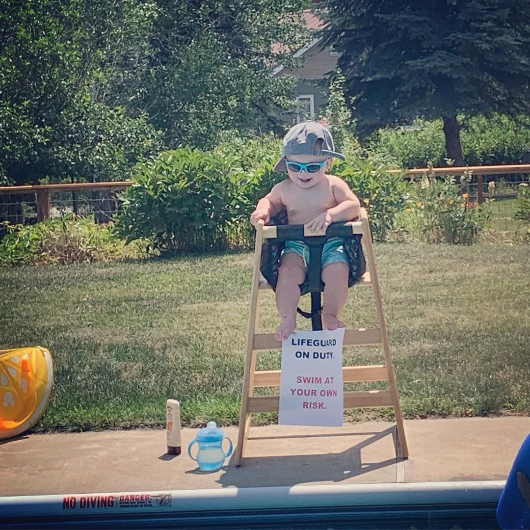 baby life guard by pool. funny sign